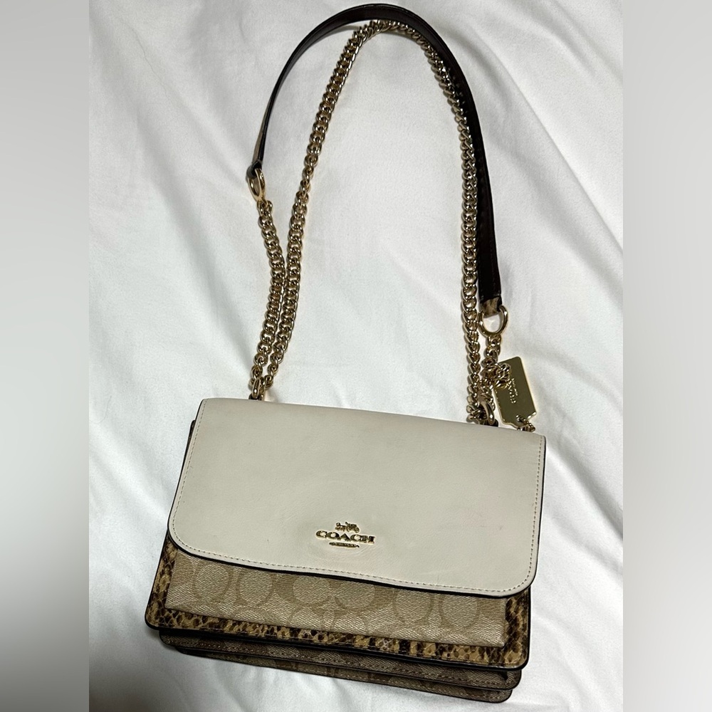 Klare Coach White and Brown Women's Bag, no call outs on interior of the bag .